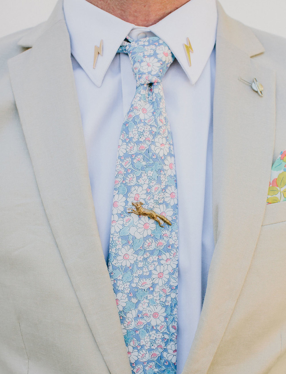  We’re diggin’ this floral tie + linen suit from  ASOS  (perfect for the beach wedding, might we add). 
